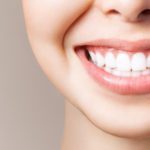 Perfect healthy teeth smile of a young woman. Teeth whitening. Dental clinic patient. Image symbolizes oral care dentistry, stomatology. Dentistry image.