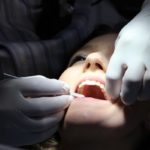 Woman getting her teeth checked