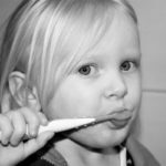 kid brushing teeth