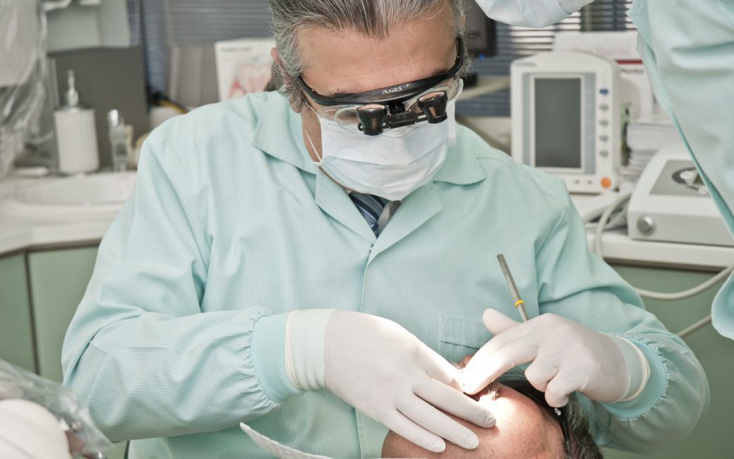 Dentist performing dental procedure